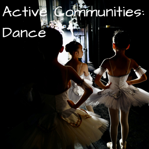 Active Communities: Dance three young girls wait behind stage before going on.